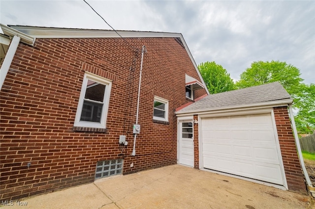 459 N Osborn Ave, Youngstown, OH 44509 - view of side of home featuring brick siding, an outdoor structure, and driveway