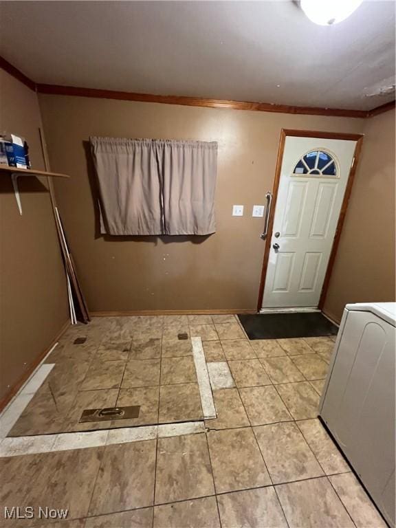 1315 18th St SW, Canton, OH 44706 - laundry area featuring crown molding and light tile patterned flooring