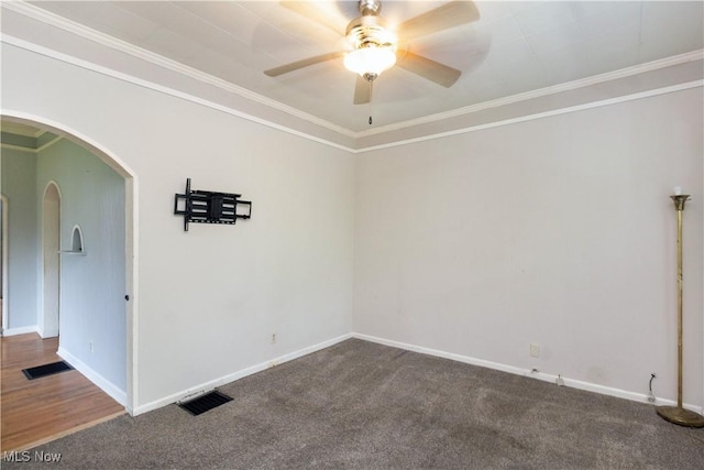 114 Mendel Ct, Elyria, OH 44035 - unfurnished room with arched walkways, a ceiling fan, carpet, baseboards, and ornamental molding