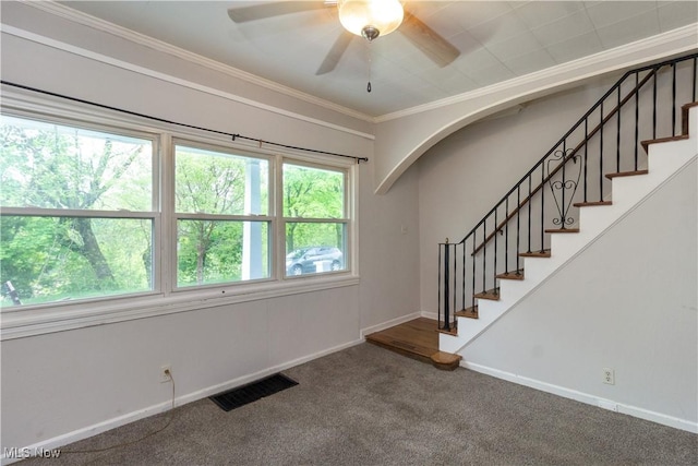 114 Mendel Ct, Elyria, OH 44035 - empty room featuring stairway, carpet floors, crown molding, ceiling fan, and baseboards
