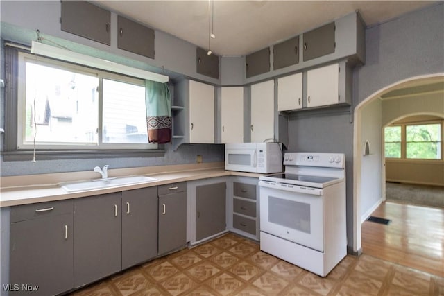 114 Mendel Ct, Elyria, OH 44035 - kitchen with white appliances, a sink, gray cabinets, and light countertops