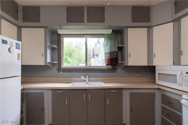 114 Mendel Ct, Elyria, OH 44035 - kitchen featuring white appliances, a sink, light countertops, and open shelves