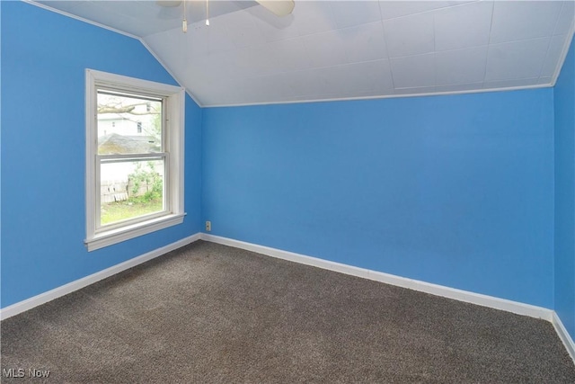 114 Mendel Ct, Elyria, OH 44035 - bonus room featuring ceiling fan, dark carpet, lofted ceiling, and baseboards