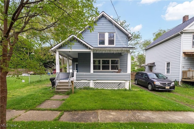 114 Mendel Ct, Elyria, OH 44035 - view of front of property featuring covered porch and a front yard