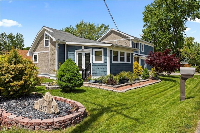 1287 E Garnet Ave, Port Clinton, OH 43452 - rear view of house featuring a lawn and french doors
