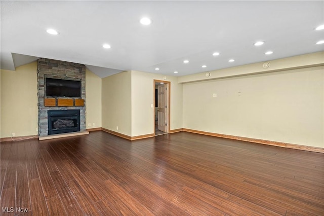 1287 E Garnet Ave, Port Clinton, OH 43452 - unfurnished living room with wood finished floors, a fireplace, recessed lighting, and baseboards