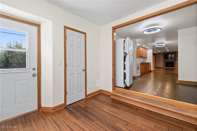 1287 E Garnet Ave, Port Clinton, OH 43452 - foyer featuring baseboards and dark wood-type flooring