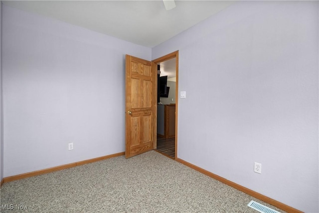1287 E Garnet Ave, Port Clinton, OH 43452 - spare room featuring carpet flooring and baseboards