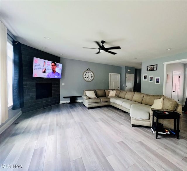 341 Cherry Rdg, Tallmadge, OH 44278 - living room featuring wood finished floors, a ceiling fan, and a fireplace