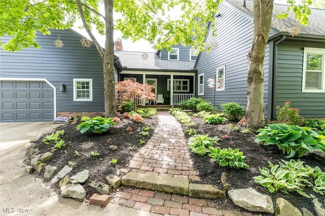 675 Wheatfield Dr, Aurora, OH 44202 - view of front of home with a porch, roof with shingles, and a chimney