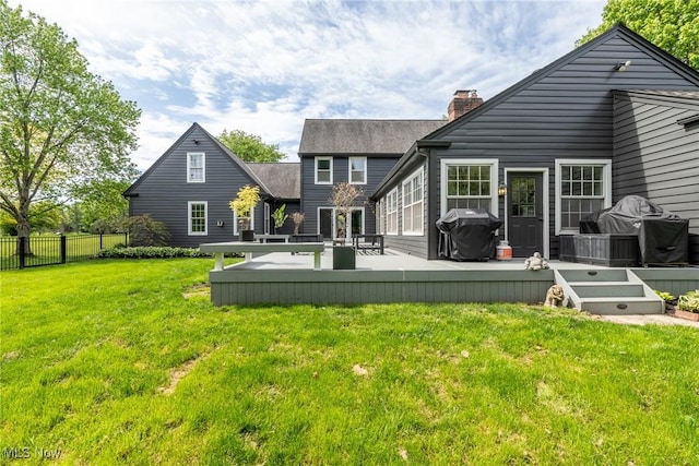 675 Wheatfield Dr, Aurora, OH 44202 - back of property featuring a chimney and a deck