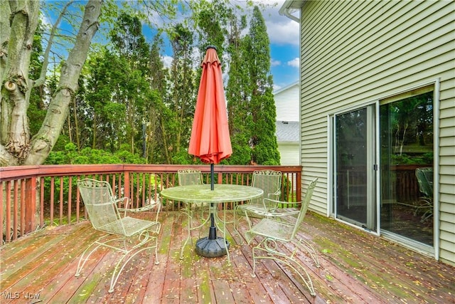 wooden deck with outdoor dining space