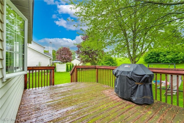 wooden terrace featuring grilling area