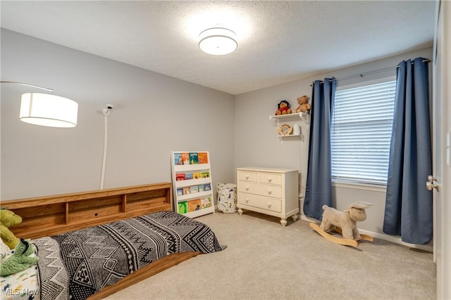 carpeted bedroom with baseboards