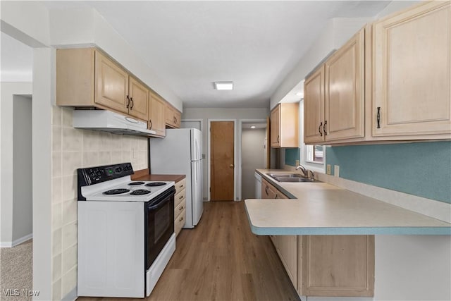 4760 Autumn Ln, Brooklyn, OH 44144 - kitchen with white appliances, under cabinet range hood, light brown cabinets, a sink, and light countertops