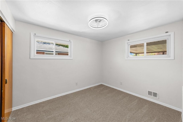 4760 Autumn Ln, Brooklyn, OH 44144 - carpeted empty room featuring healthy amount of natural light and baseboards