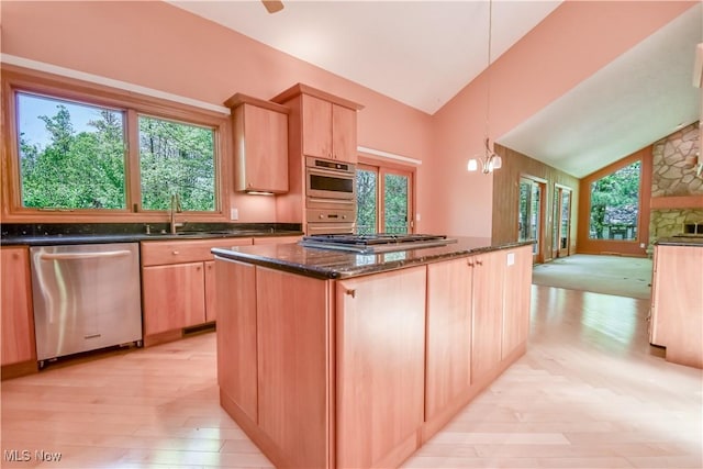 8220 Hermitage Rd, Concord, OH 44077 - kitchen with stainless steel appliances, light brown cabinets, dark stone countertops, a kitchen island, and a sink