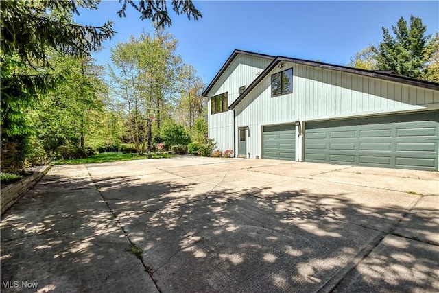 8220 Hermitage Rd, Concord, OH 44077 - view of home's exterior featuring concrete driveway