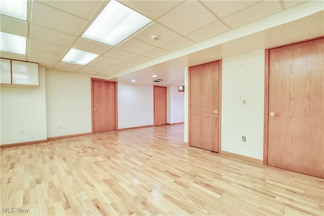 8220 Hermitage Rd, Concord, OH 44077 - spare room featuring light wood-style flooring, a drop ceiling, baseboards, and a smoke detector
