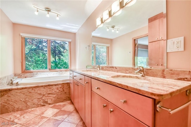 8220 Hermitage Rd, Concord, OH 44077 - bathroom featuring double vanity, a bath, tile patterned floors, and rail lighting