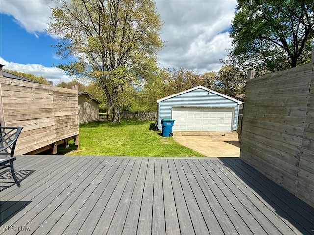 deck with a garage and an outbuilding