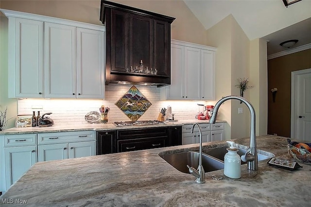 176 Highland Mist Cir, Hinckley, OH 44233 - kitchen with a sink, stainless steel gas cooktop, light stone counters, tasteful backsplash, and white cabinetry