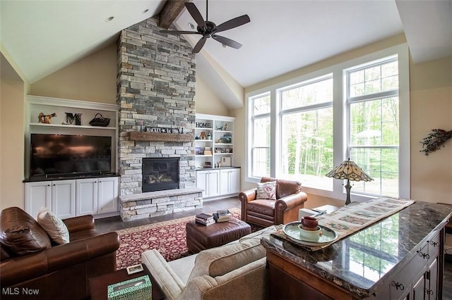 176 Highland Mist Cir, Hinckley, OH 44233 - living area with healthy amount of natural light, a ceiling fan, a fireplace, beamed ceiling, and high vaulted ceiling