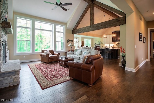 176 Highland Mist Cir, Hinckley, OH 44233 - living room with a stone fireplace, a ceiling fan, high vaulted ceiling, baseboards, and dark wood finished floors