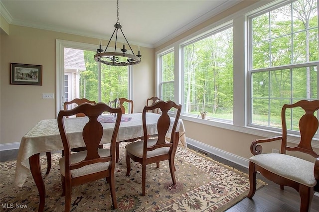 176 Highland Mist Cir, Hinckley, OH 44233 - dining room featuring baseboards, ornamental molding, wood finished floors, and a chandelier
