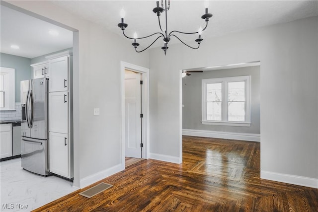 406 39th St, Vienna, WV 26105 - unfurnished dining area featuring a chandelier, baseboards, a ceiling fan, and recessed lighting