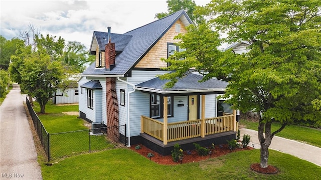 406 39th St, Vienna, WV 26105 - view of front facade featuring a porch, cooling unit, and a shingled roof