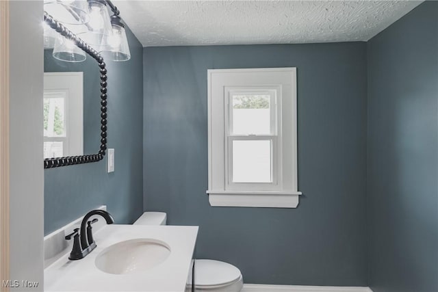 406 39th St, Vienna, WV 26105 - half bath featuring toilet, a textured ceiling, and vanity