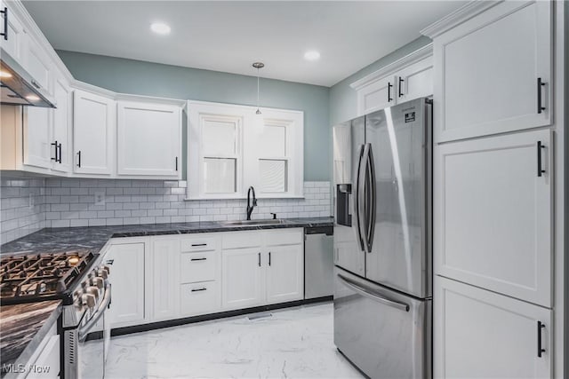 406 39th St, Vienna, WV 26105 - kitchen with stainless steel appliances, a sink, light marble finish flooring, white cabinets, and tasteful backsplash