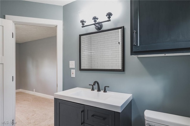 406 39th St, Vienna, WV 26105 - bathroom featuring toilet, vanity, and baseboards