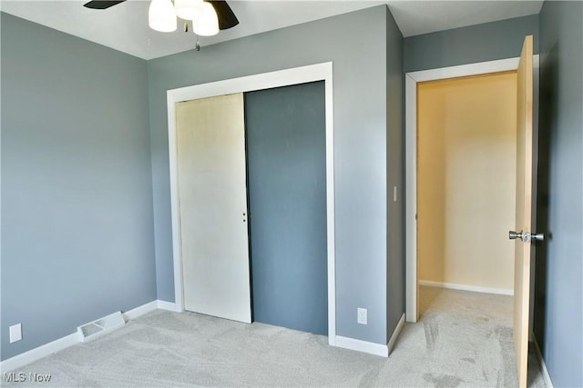 9960 Ridge Rdg, Farmdale, OH 44417 - unfurnished bedroom with carpet floors, a closet, baseboards, and a ceiling fan