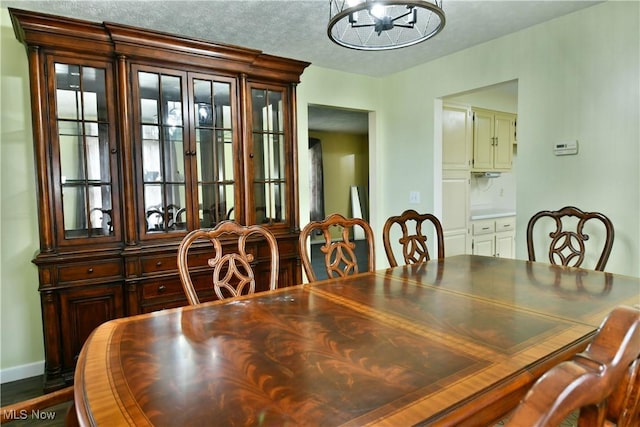 9960 Ridge Rdg, Farmdale, OH 44417 - dining space featuring baseboards, a chandelier, and dark wood-style flooring