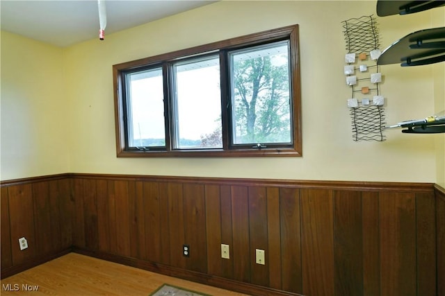 9960 Ridge Rdg, Farmdale, OH 44417 - spare room with a wainscoted wall, wood walls, and wood finished floors