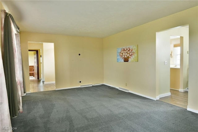 9960 Ridge Rdg, Farmdale, OH 44417 - unfurnished room with dark colored carpet and baseboards