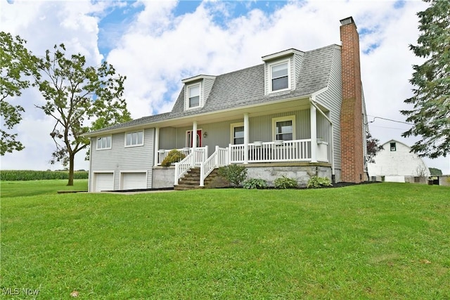 9960 Ridge Rdg, Farmdale, OH 44417 - view of front of home with a chimney, covered porch, a front yard, an attached garage, and roof with shingles