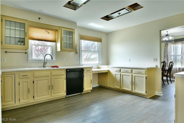 9960 Ridge Rdg, Farmdale, OH 44417 - kitchen featuring black dishwasher, a sink, healthy amount of natural light, and wood finished floors