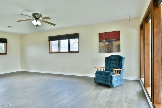 9960 Ridge Rdg, Farmdale, OH 44417 - unfurnished room featuring wood finished floors, a ceiling fan, and baseboards