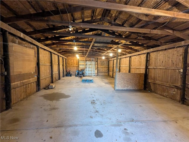 5216 Arrow Rd NW, Minerva, OH 44657 - misc room with a garage, lofted ceiling, and concrete floors