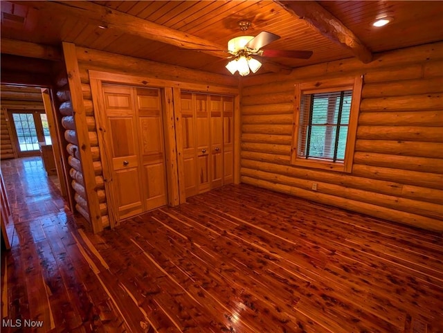 5216 Arrow Rd NW, Minerva, OH 44657 - unfurnished bedroom featuring beamed ceiling, dark wood finished floors, wooden ceiling, and multiple windows