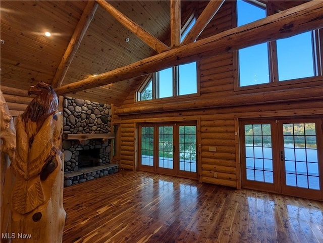 5216 Arrow Rd NW, Minerva, OH 44657 - unfurnished living room with high vaulted ceiling, wood ceiling, plenty of natural light, hardwood / wood-style flooring, and a fireplace