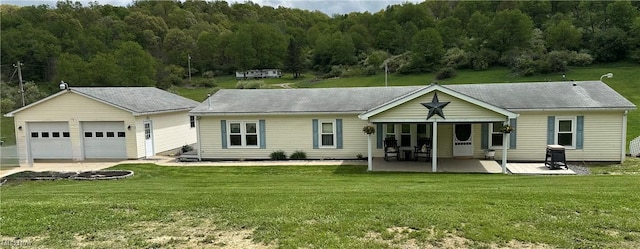 1367 Arner Rd, Chester, WV 26034 - view of front of home with a front yard, an outbuilding, and a patio area