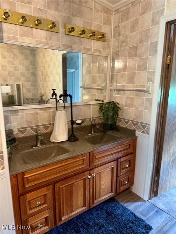 1367 Arner Rd, Chester, WV 26034 - bathroom featuring backsplash, double vanity, and wood finished floors