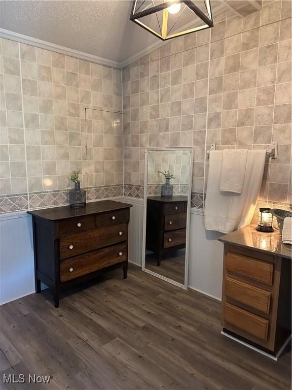 1367 Arner Rd, Chester, WV 26034 - bathroom featuring tile walls, wood finished floors, a textured ceiling, and crown molding