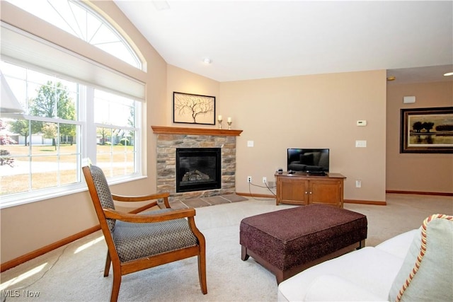 2618 Weatherington Ln Unit 264, Wooster, OH 44691 - living room featuring baseboards, light colored carpet, vaulted ceiling, plenty of natural light, and a glass covered fireplace