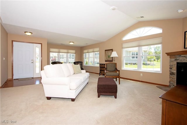 2618 Weatherington Ln Unit 264, Wooster, OH 44691 - living area with lofted ceiling, a fireplace, light colored carpet, and baseboards