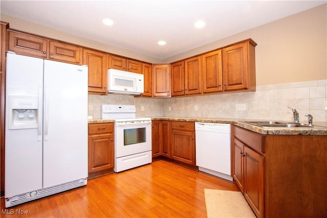 2618 Weatherington Ln Unit 264, Wooster, OH 44691 - kitchen featuring white appliances, a sink, brown cabinetry, and recessed lighting